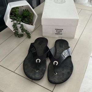 Versace black “GV” thong sandals